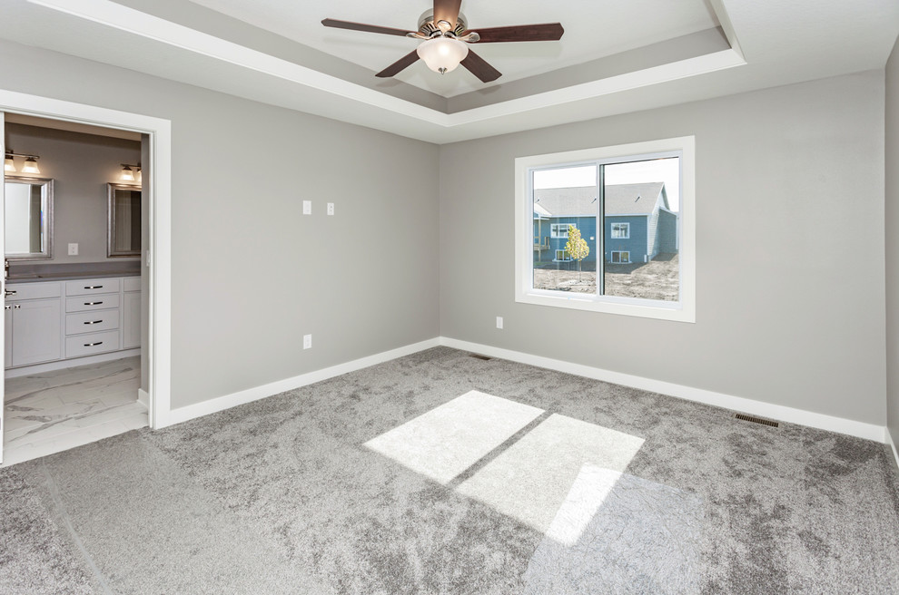 Photo of a medium sized classic master bedroom in Other with grey walls, brick flooring, no fireplace and grey floors.