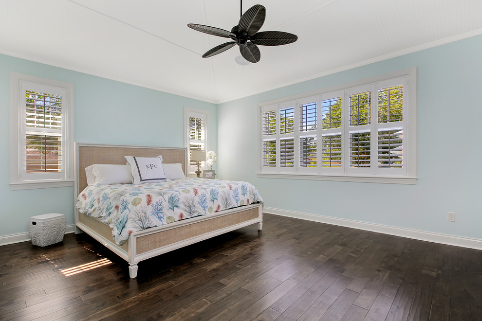 Inspiration for a large coastal master dark wood floor bedroom remodel in Tampa with green walls