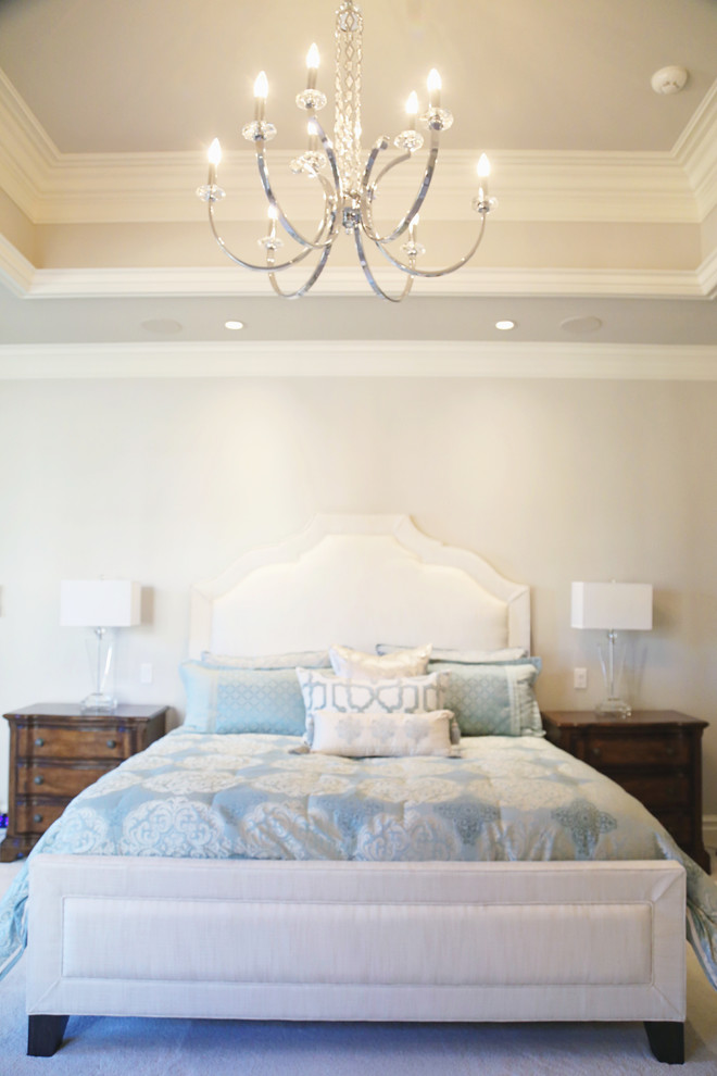 Inspiration for a mid-sized transitional master carpeted bedroom remodel in Other with white walls and no fireplace
