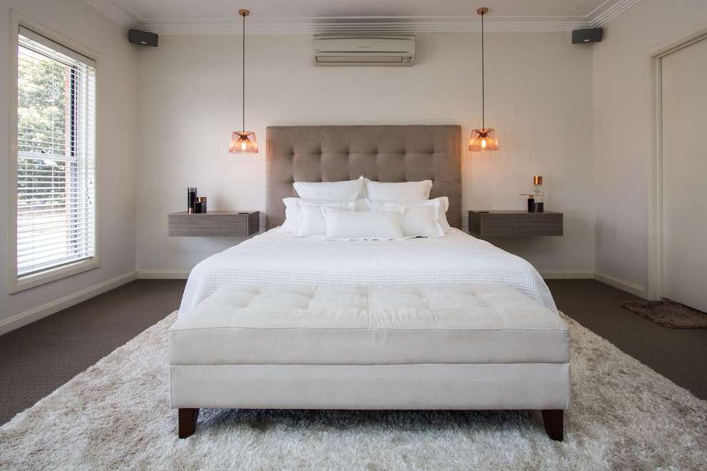 Classic grey and brown bedroom in Sydney with beige walls, carpet and no fireplace.