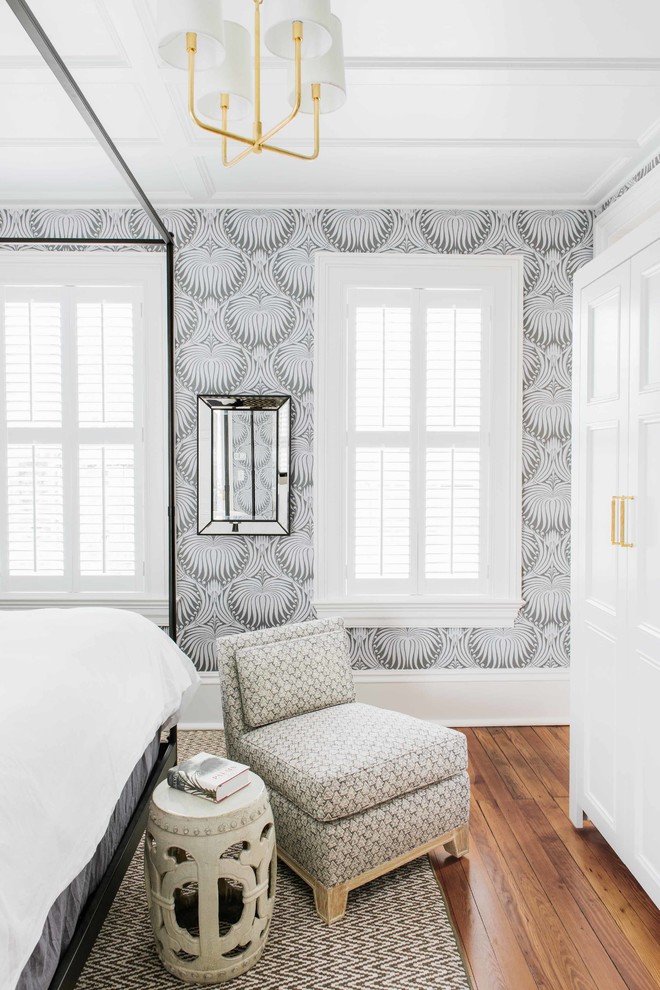 Inspiration for a large transitional master brown floor and medium tone wood floor bedroom remodel in Charleston with gray walls and no fireplace