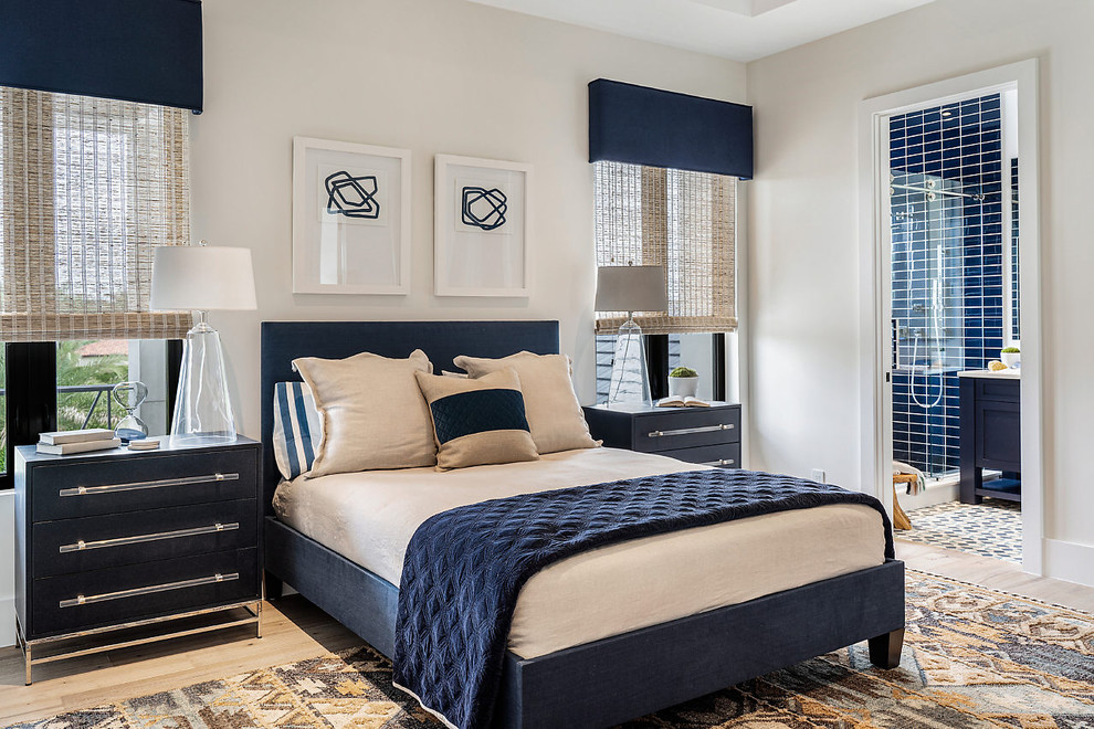Inspiration for a nautical guest bedroom in Other with white walls, light hardwood flooring and no fireplace.