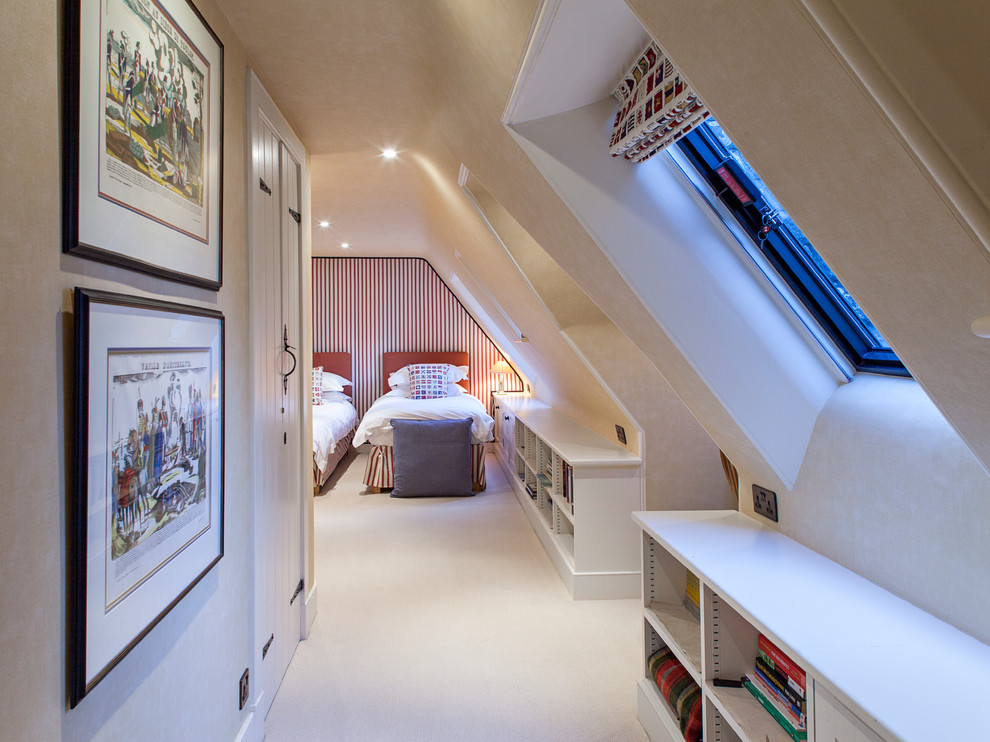 Bedroom - traditional carpeted bedroom idea in London with beige walls
