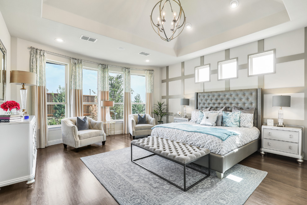 This is an example of a large traditional master and grey and brown bedroom in Dallas with brown floors, multi-coloured walls, dark hardwood flooring, no fireplace and feature lighting.