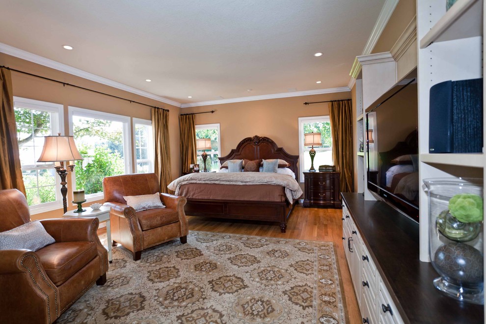 This is an example of a medium sized classic master bedroom in Portland with beige walls, medium hardwood flooring and no fireplace.