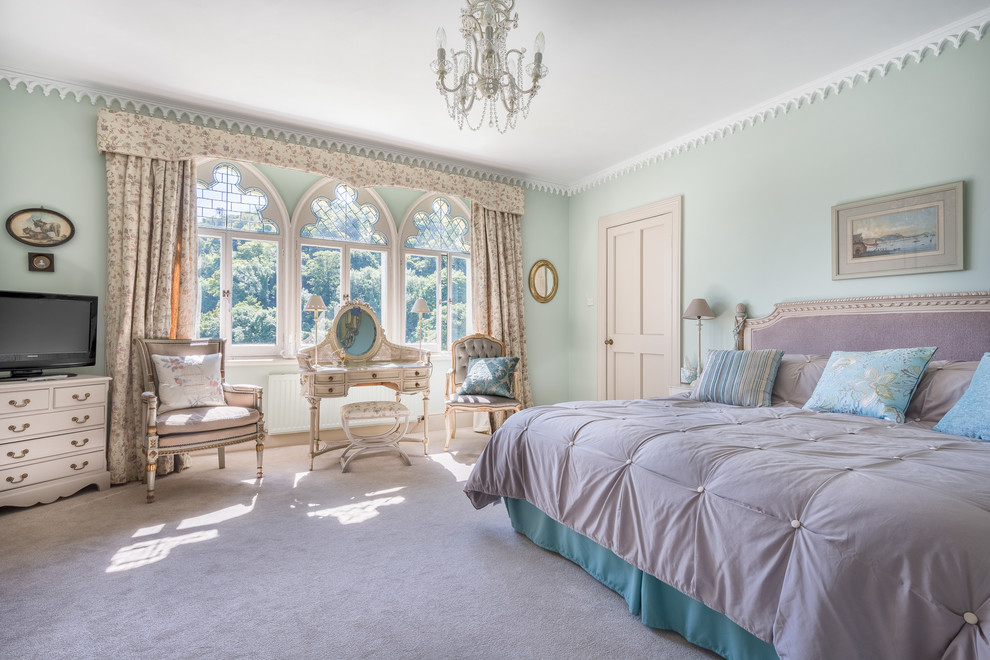 Inspiration for a large victorian guest carpeted bedroom remodel in Devon with blue walls