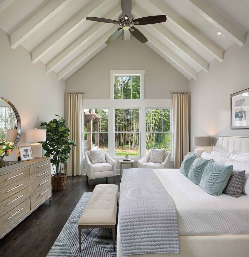 Design ideas for a medium sized traditional master bedroom in Charlotte with grey walls, medium hardwood flooring and brown floors.