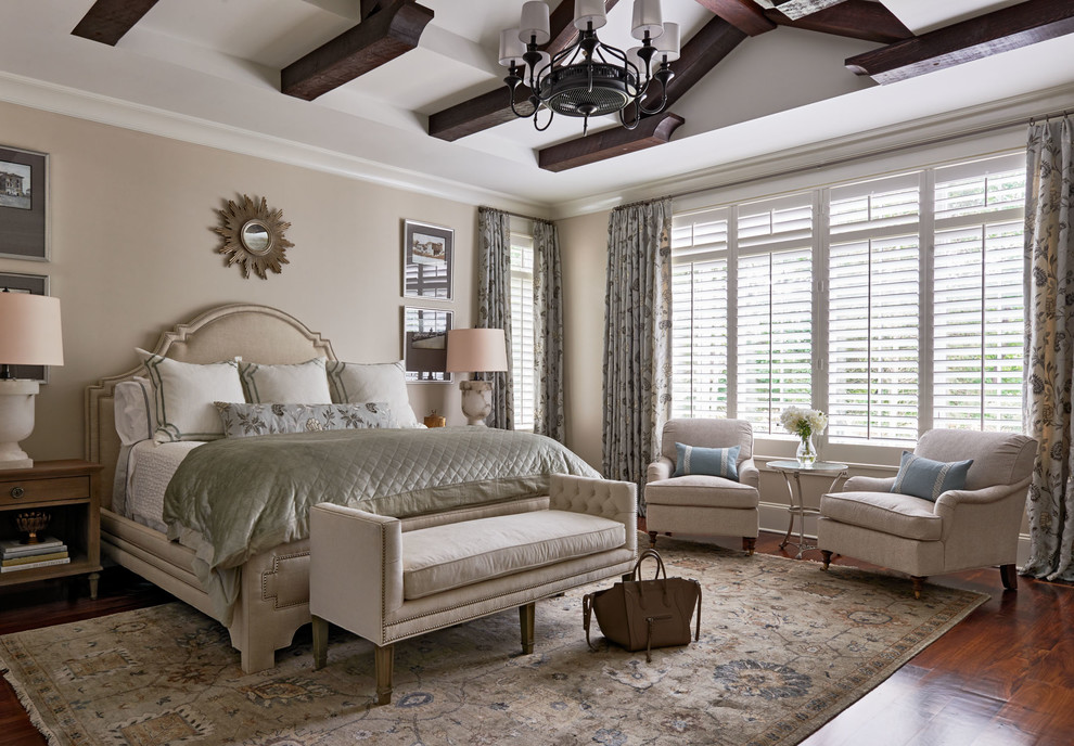 Inspiration for a timeless master medium tone wood floor bedroom remodel in Charlotte with beige walls