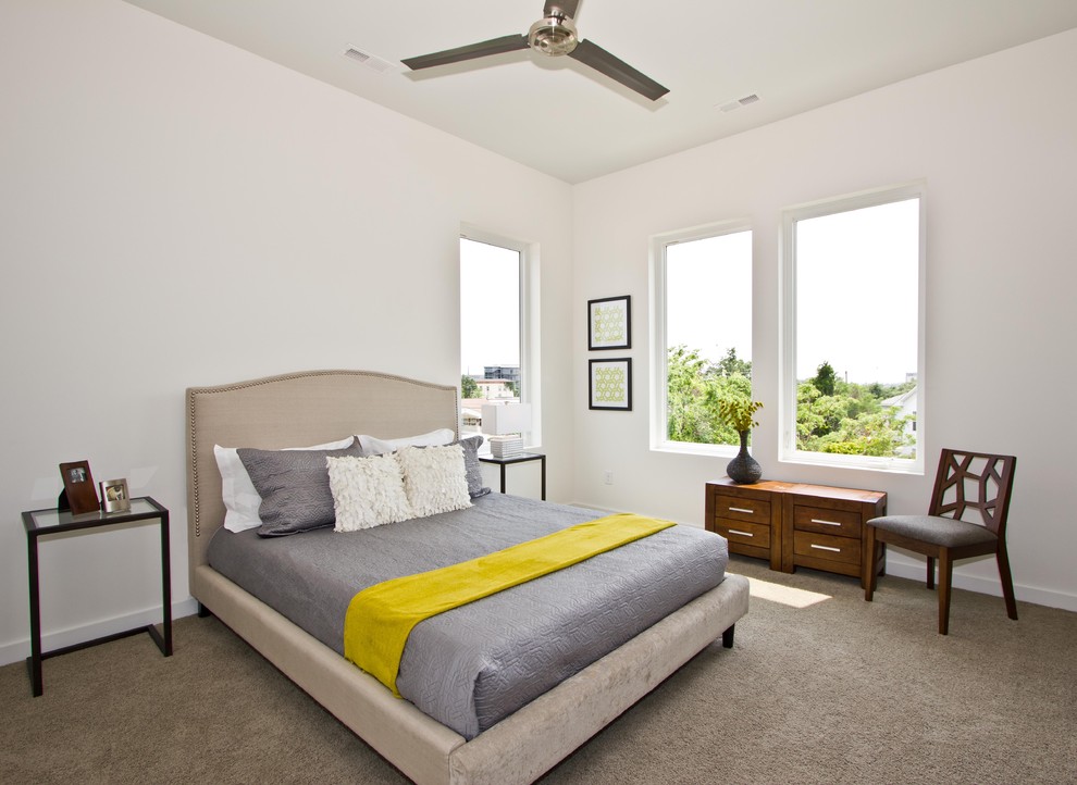 This is an example of a contemporary bedroom in Other with white walls, carpet and no fireplace.