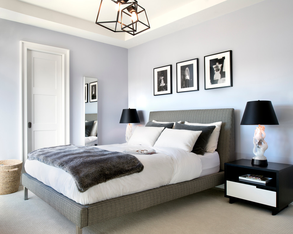 Inspiration for a transitional bedroom remodel in Los Angeles with purple walls