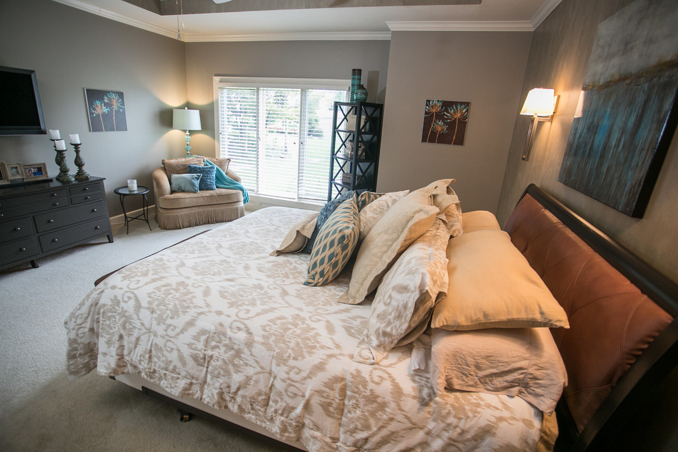 Photo of a large classic master bedroom in Kansas City with carpet.