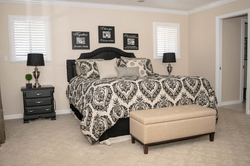 Inspiration for a medium sized classic master bedroom in Sacramento with beige walls, carpet, no fireplace and beige floors.