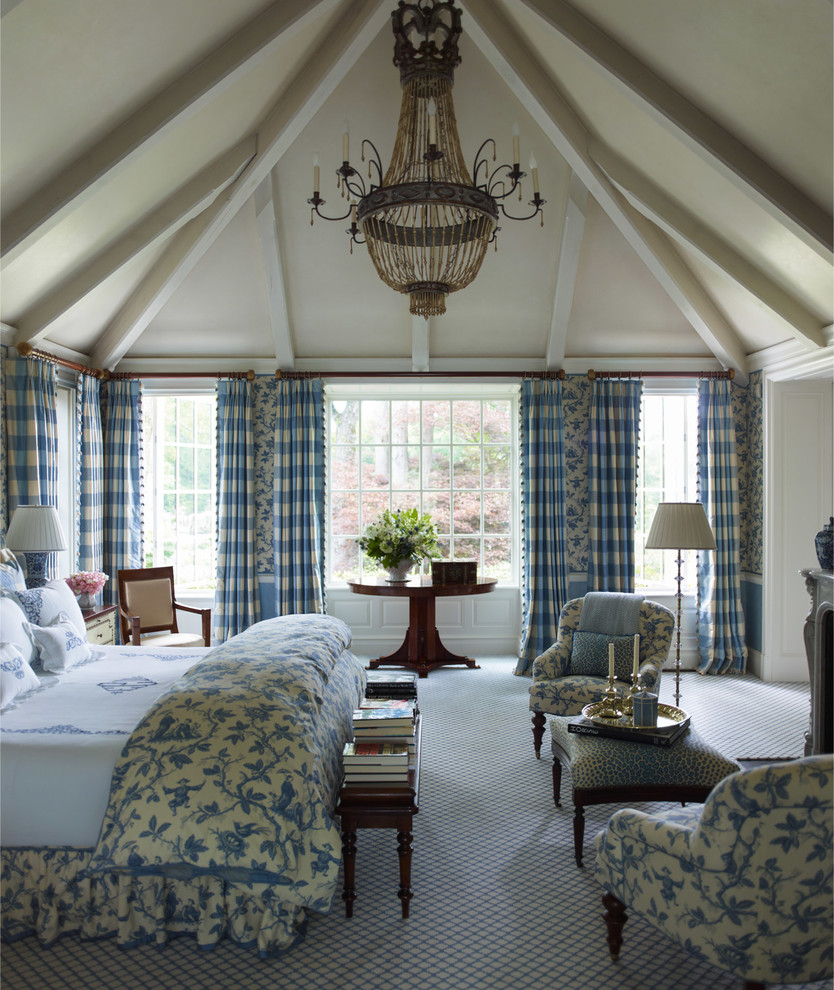 Inspiration for a large classic master bedroom in New York with blue walls and carpet.