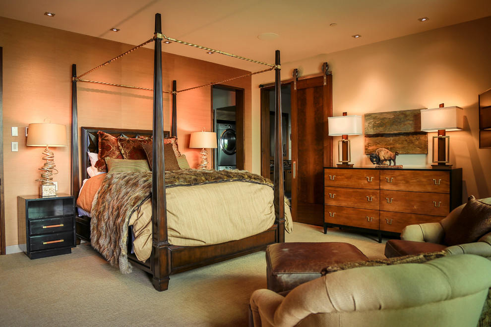 Example of a mid-sized mountain style master carpeted bedroom design in Salt Lake City with beige walls and no fireplace