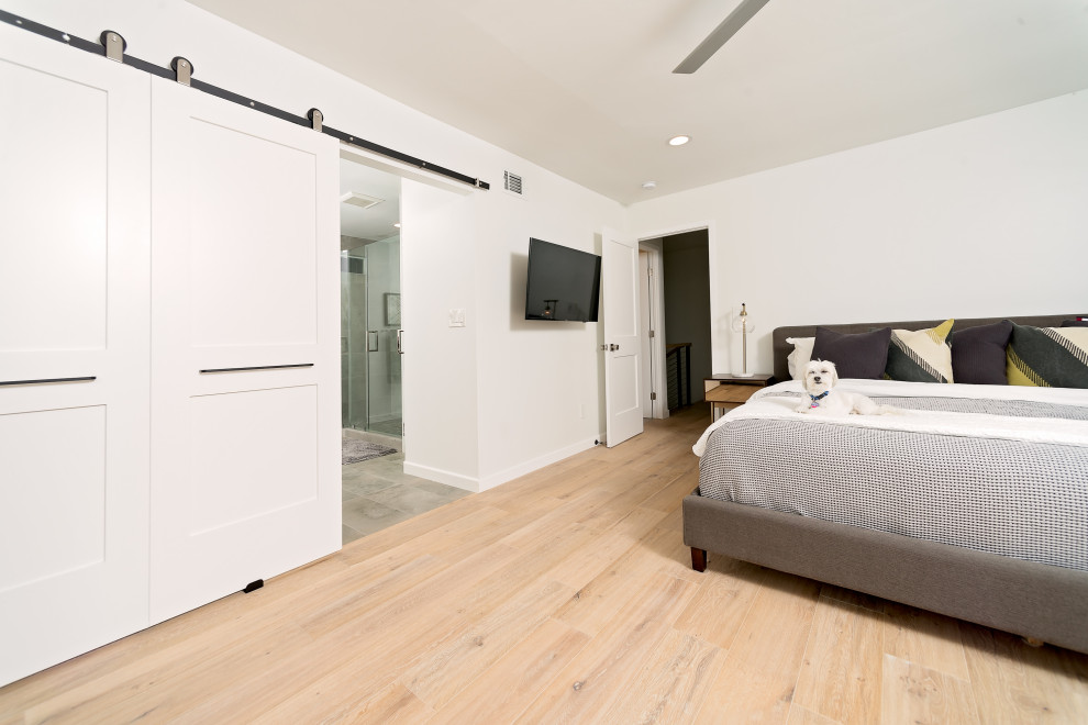 Bedroom - large contemporary master vinyl floor and beige floor bedroom idea in San Diego with white walls and no fireplace