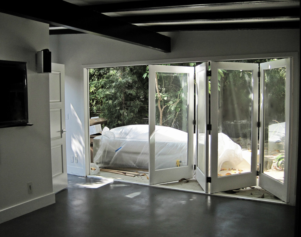 Photo of a medium sized modern mezzanine bedroom in Los Angeles with laminate floors.