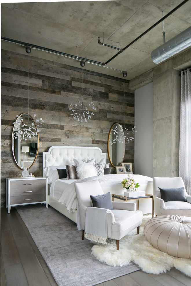 Medium sized industrial master bedroom in Denver with white walls, medium hardwood flooring and grey floors.
