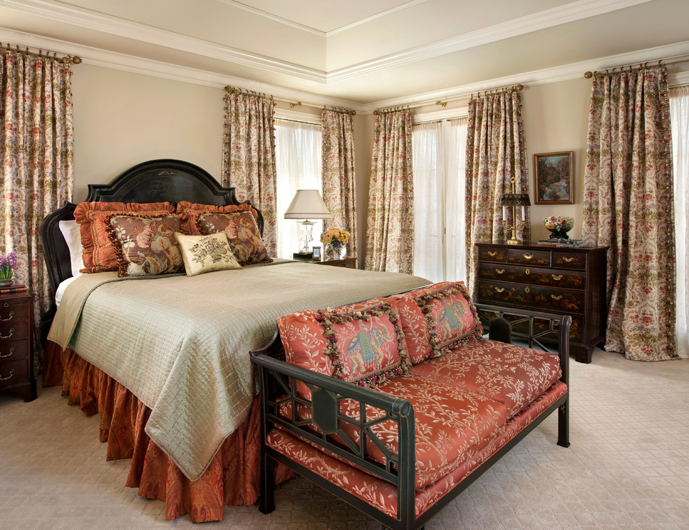 Design ideas for a large traditional master bedroom in Denver with beige walls and carpet.