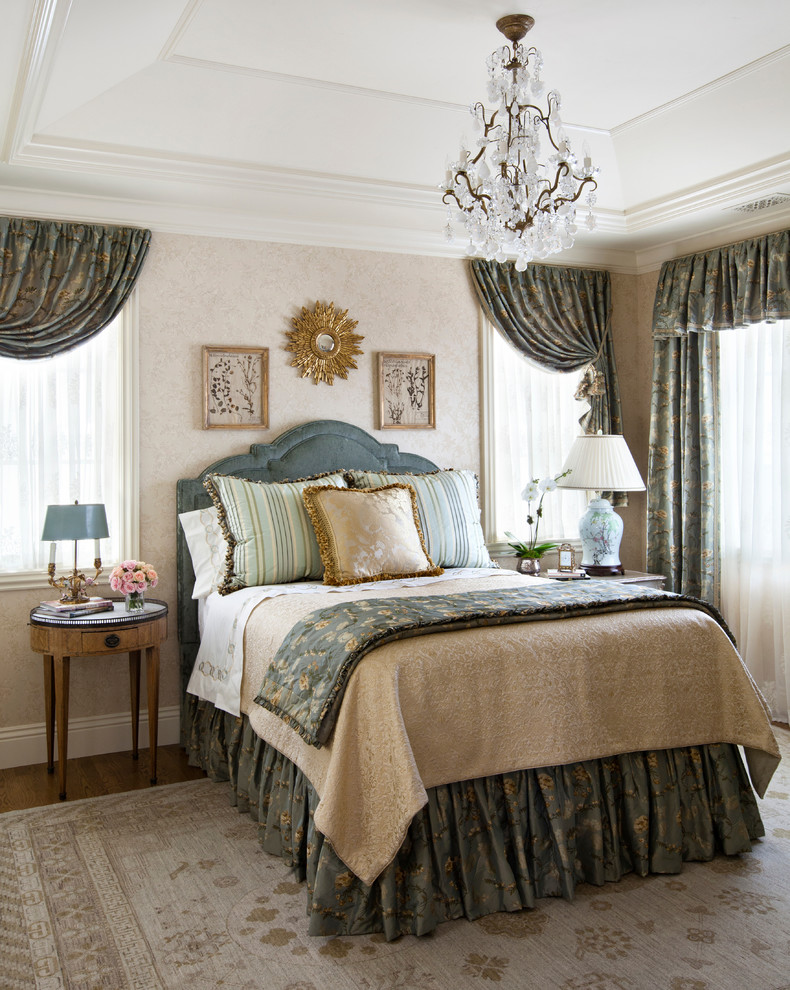 Design ideas for a large traditional guest bedroom in Denver with beige walls and medium hardwood flooring.