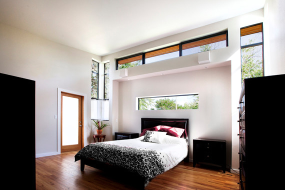 Example of a minimalist bedroom design in Denver