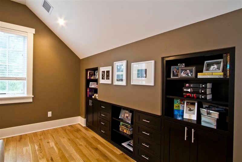 Inspiration for a mid-sized transitional master light wood floor bedroom remodel in Denver with brown walls and no fireplace
