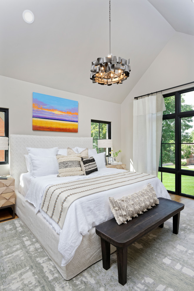Medium sized contemporary master bedroom in Denver with beige walls, medium hardwood flooring and no fireplace.
