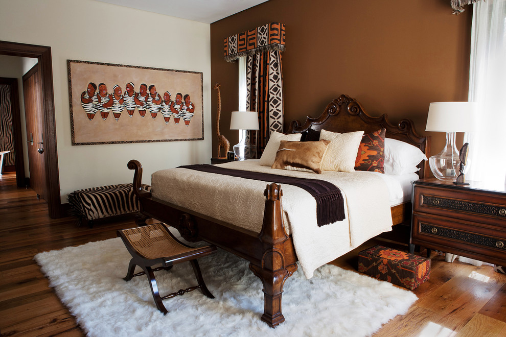Example of a trendy medium tone wood floor bedroom design in Denver with brown walls