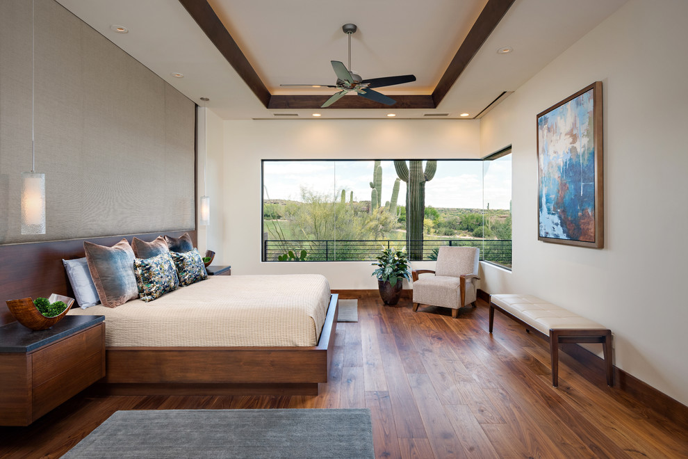 Example of a trendy master dark wood floor and brown floor bedroom design in Phoenix with brown walls