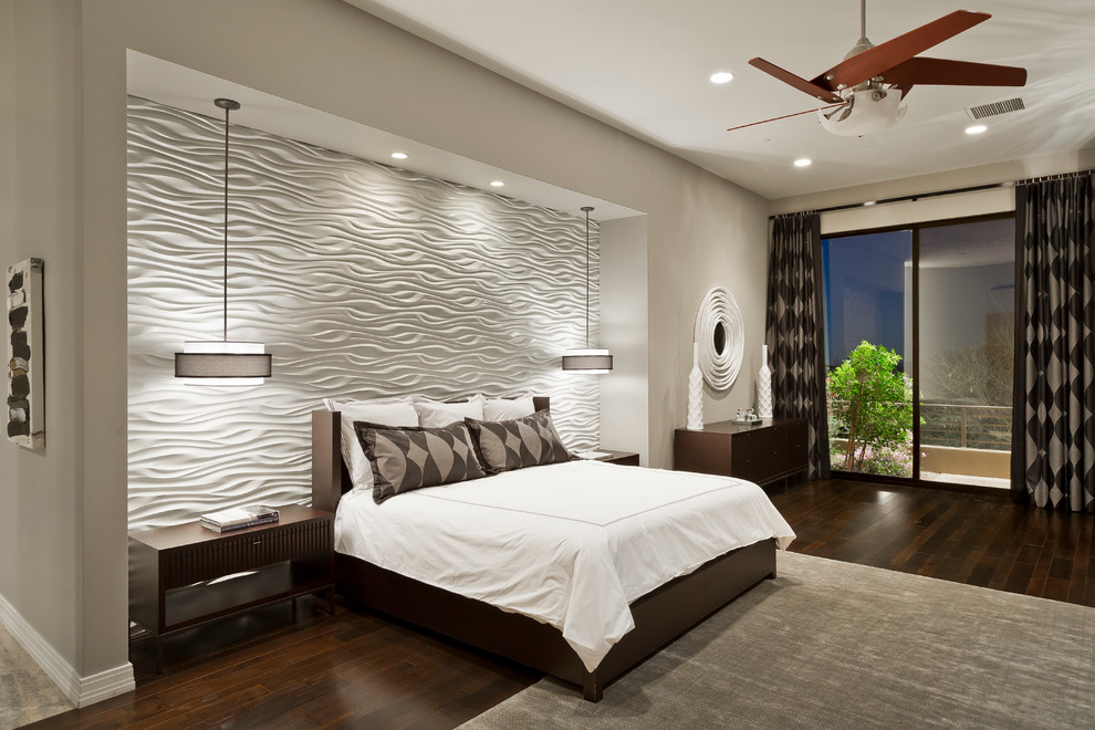 Inspiration for an expansive contemporary master bedroom in Phoenix with grey walls, dark hardwood flooring and feature lighting.