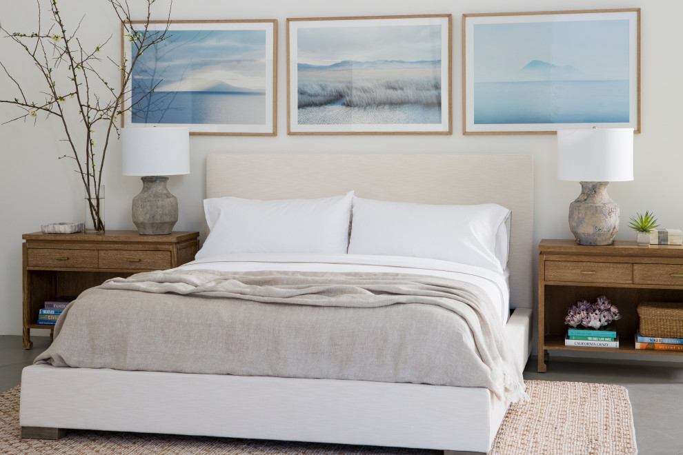Imagen de dormitorio contemporáneo con paredes blancas, suelo de cemento y suelo gris