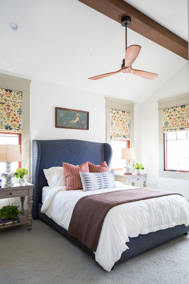 This is an example of an eclectic bedroom in San Diego with white walls, carpet and grey floors.