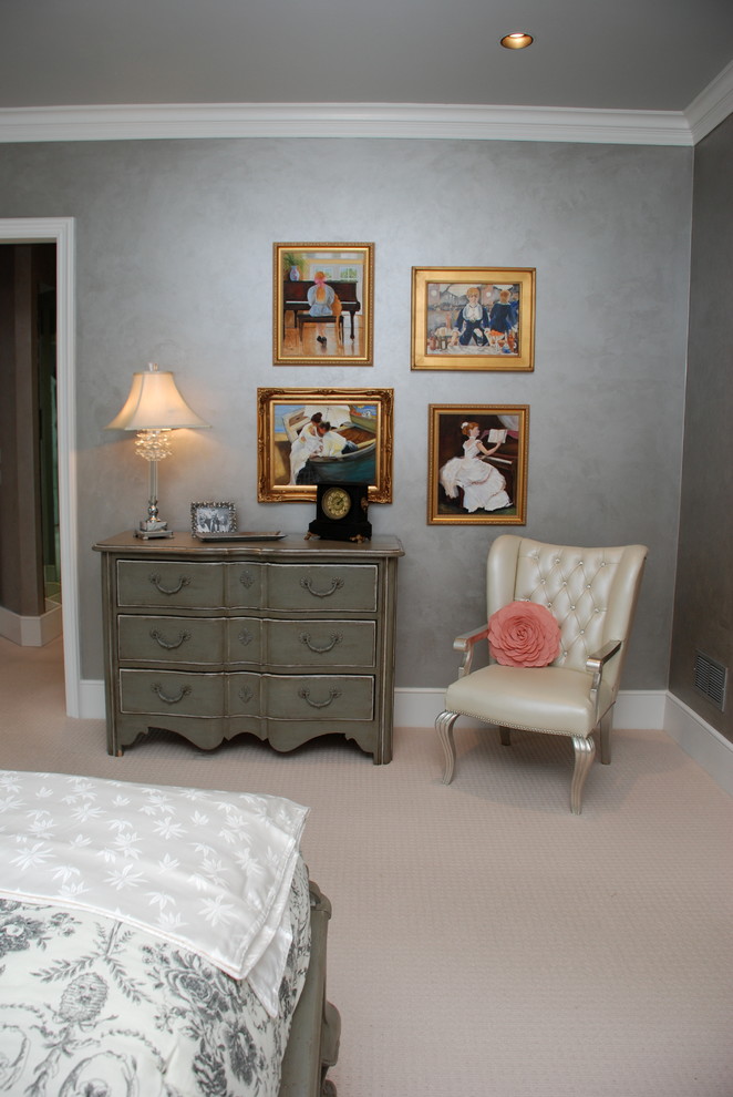 Example of a large classic master carpeted bedroom design in Tampa with gray walls and no fireplace