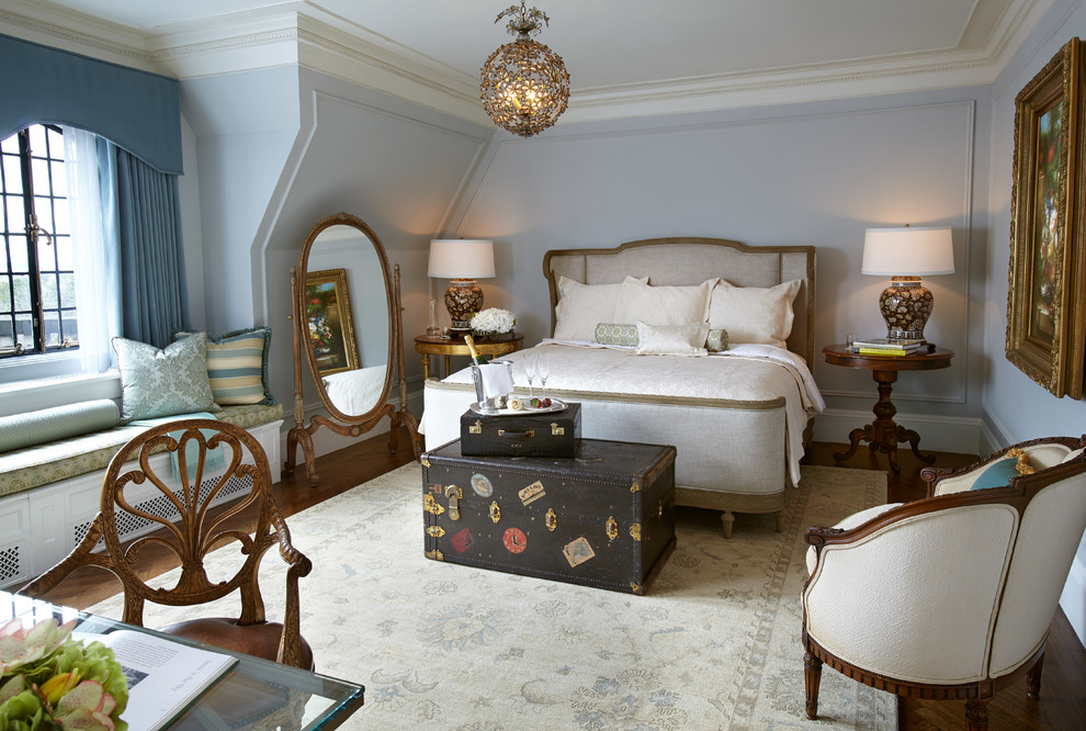This is an example of a traditional bedroom in New York with dark hardwood flooring and grey walls.