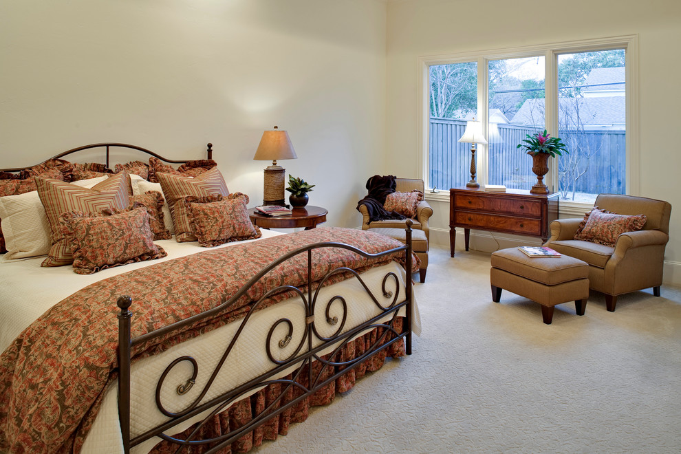 Example of a mid-sized classic master carpeted bedroom design in Dallas with beige walls