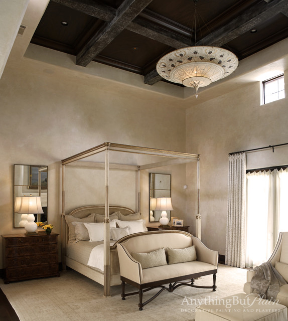 Huge master dark wood floor bedroom photo in Houston with beige walls and no fireplace