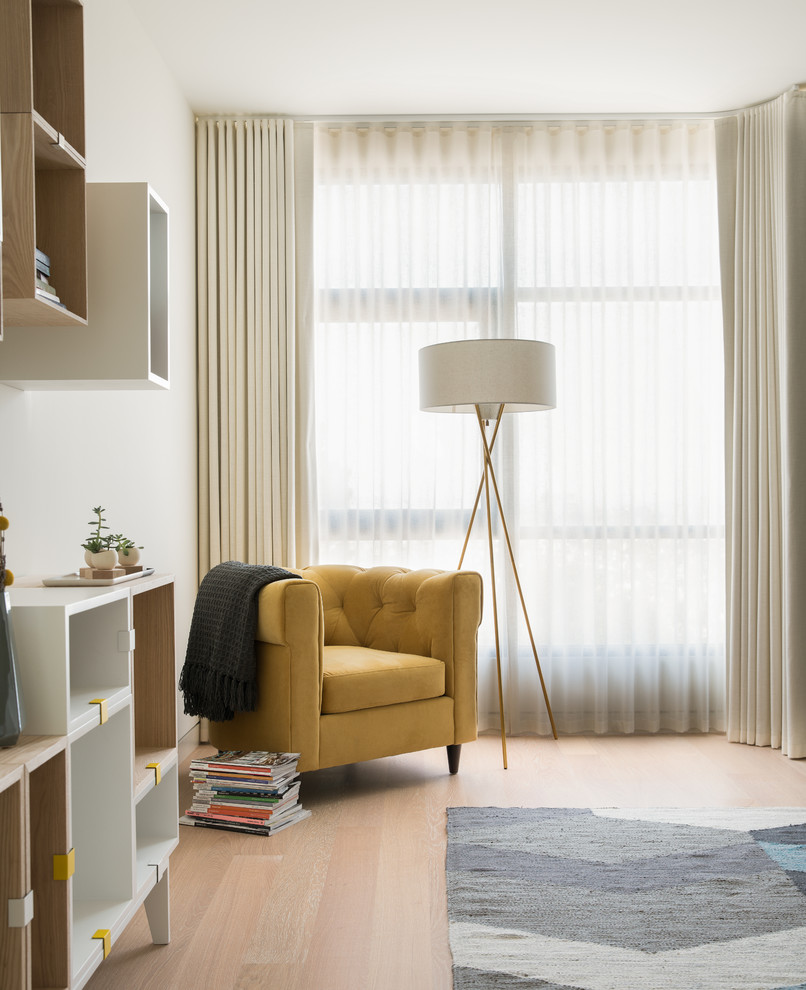 Example of a large trendy master light wood floor bedroom design in San Francisco with white walls
