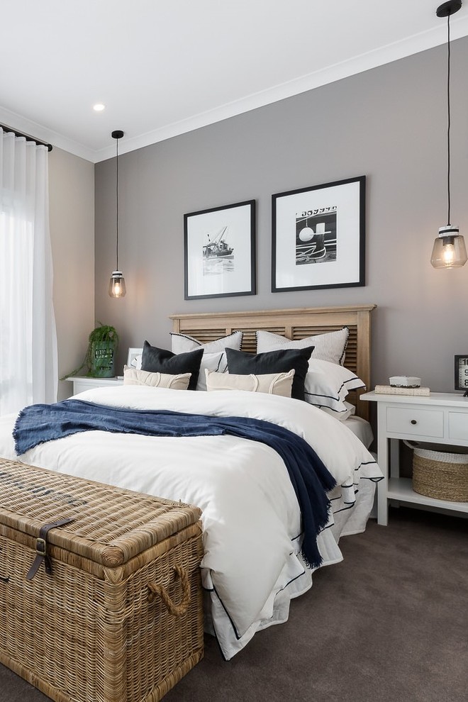 Photo of a coastal grey and brown bedroom in Other with beige walls, carpet and brown floors.