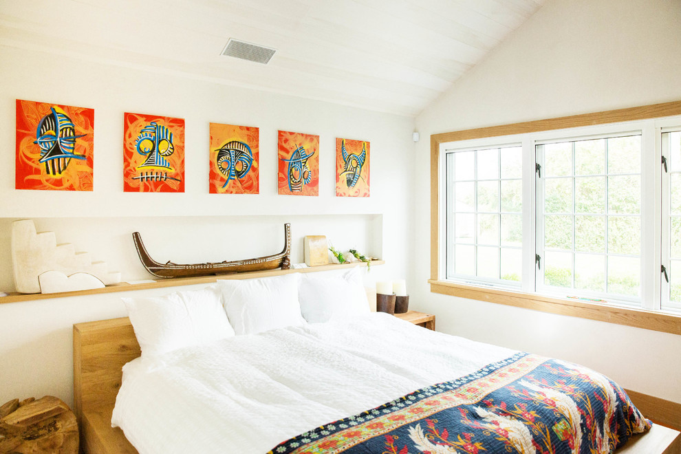 Bedroom - coastal master bedroom idea in New York with white walls