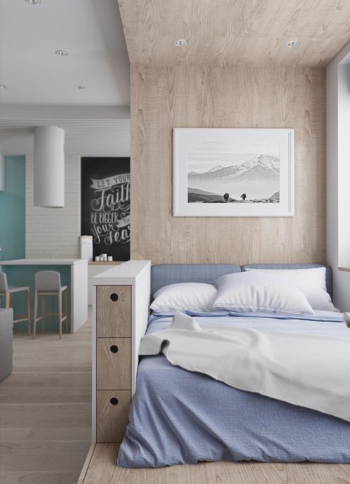 Foto di una piccola camera da letto stile loft scandinava con pareti beige e parquet chiaro