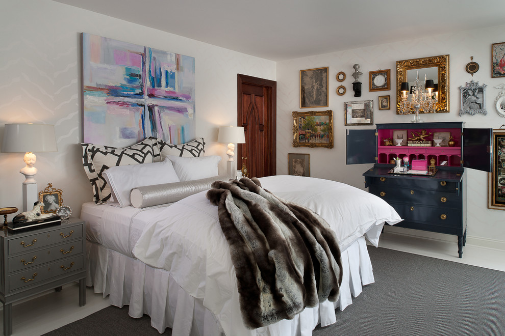 Large eclectic grey and pink bedroom in New York with white walls, no fireplace and white floors.