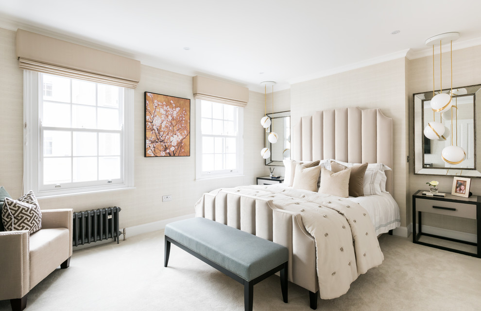 Design ideas for a traditional master bedroom in London with beige walls, carpet and beige floors.