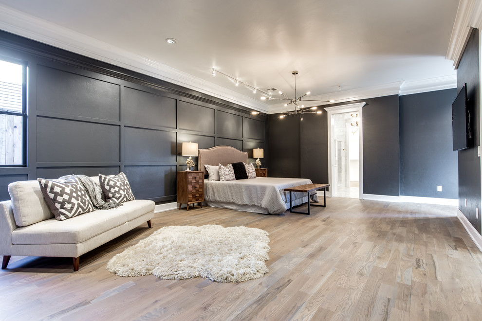 Design ideas for an expansive classic master bedroom in Oklahoma City with black walls and medium hardwood flooring.