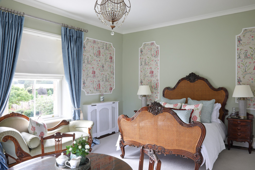 Elegant bedroom photo in Dorset with green walls