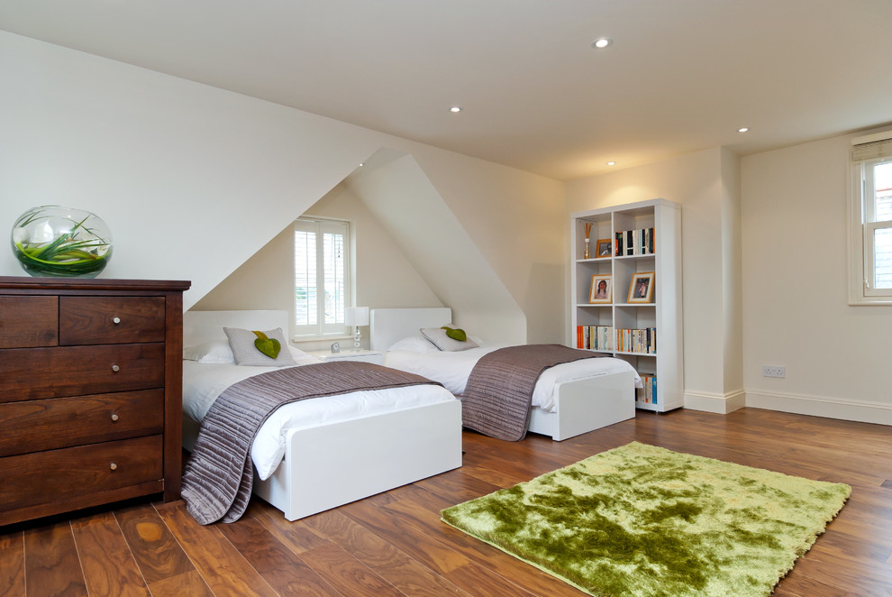 This is an example of a contemporary loft bedroom in Surrey.