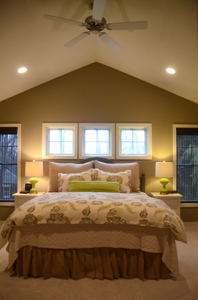 Photo of a large classic master bedroom in Grand Rapids with green walls, carpet and no fireplace.