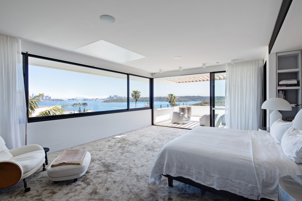 Inspiration for a modern carpeted and gray floor bedroom remodel in Sydney with white walls
