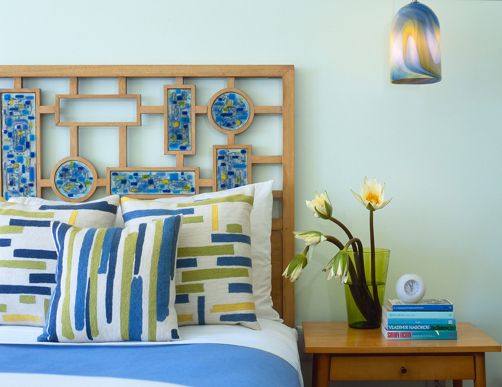 Example of a transitional bedroom design in New York with blue walls