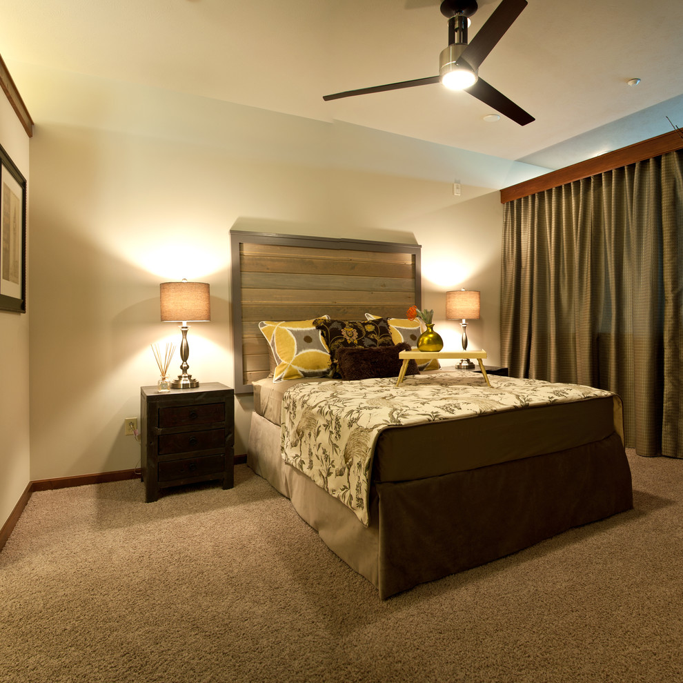 Inspiration for an eclectic master bedroom in Wichita with beige walls and carpet.
