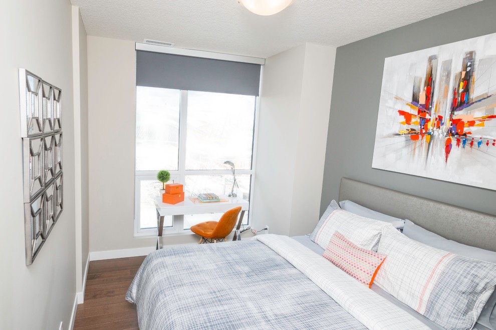 Bedroom - small contemporary guest medium tone wood floor bedroom idea in Edmonton with gray walls and no fireplace