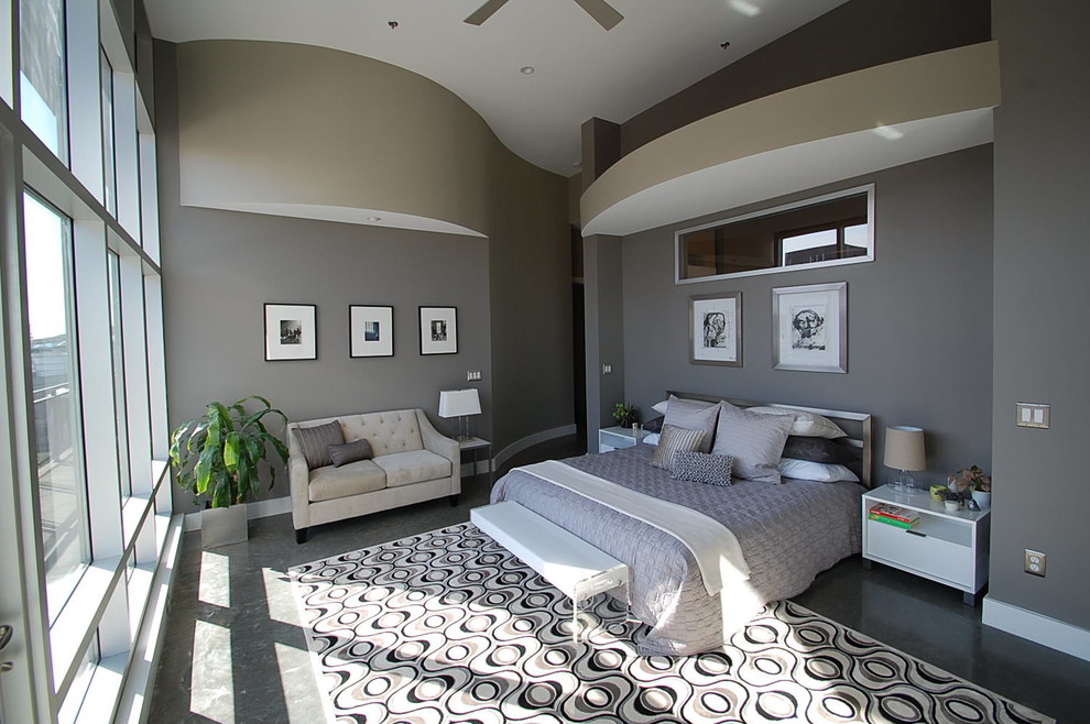 This is an example of a large contemporary master bedroom in Cincinnati with grey walls, concrete flooring, no fireplace and grey floors.